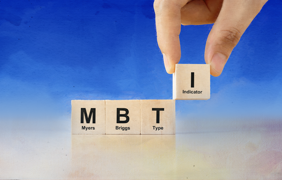 four wooden blocks being places in a line representing the MBTI test.png