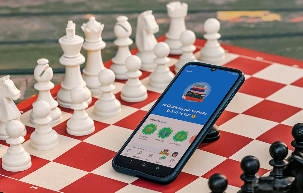 mobile phone on the WeBuyBooks app on a chessboard.png